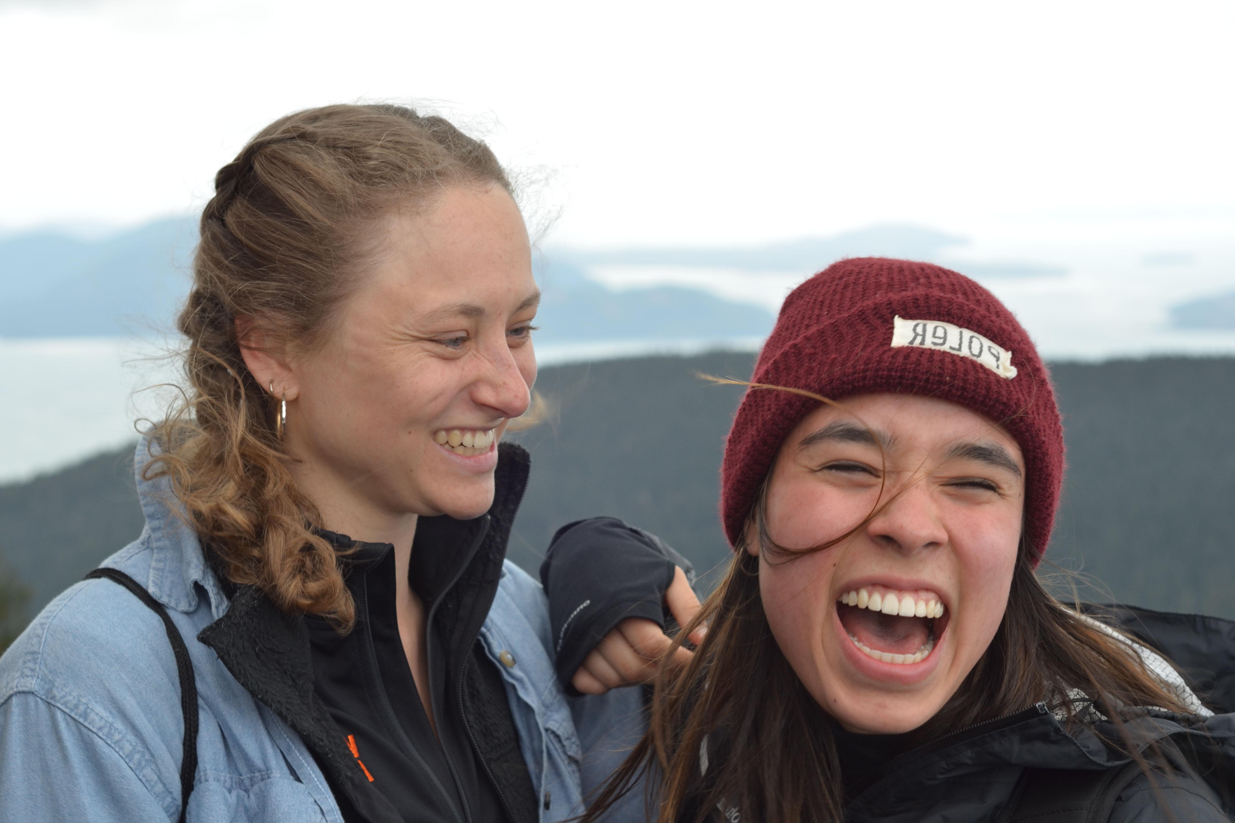 Two students sharing a laugh on Outdoor Retreat.